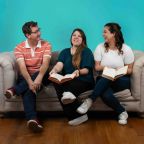 Three people sharing a conversation on a sofa, pictured in Inflectiv’s sixth-anniversary post.